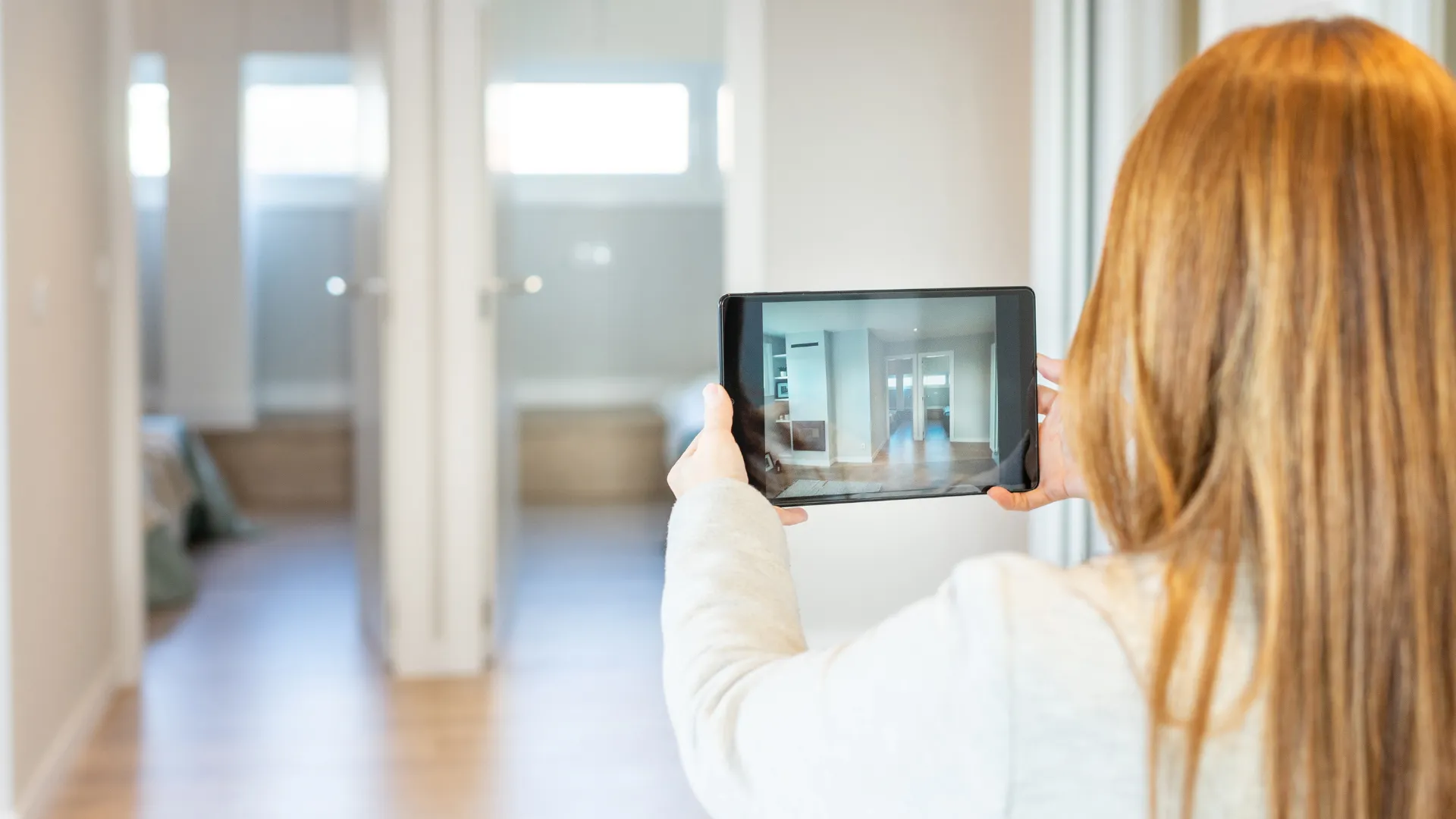 Real estate agent showing a home to a young family