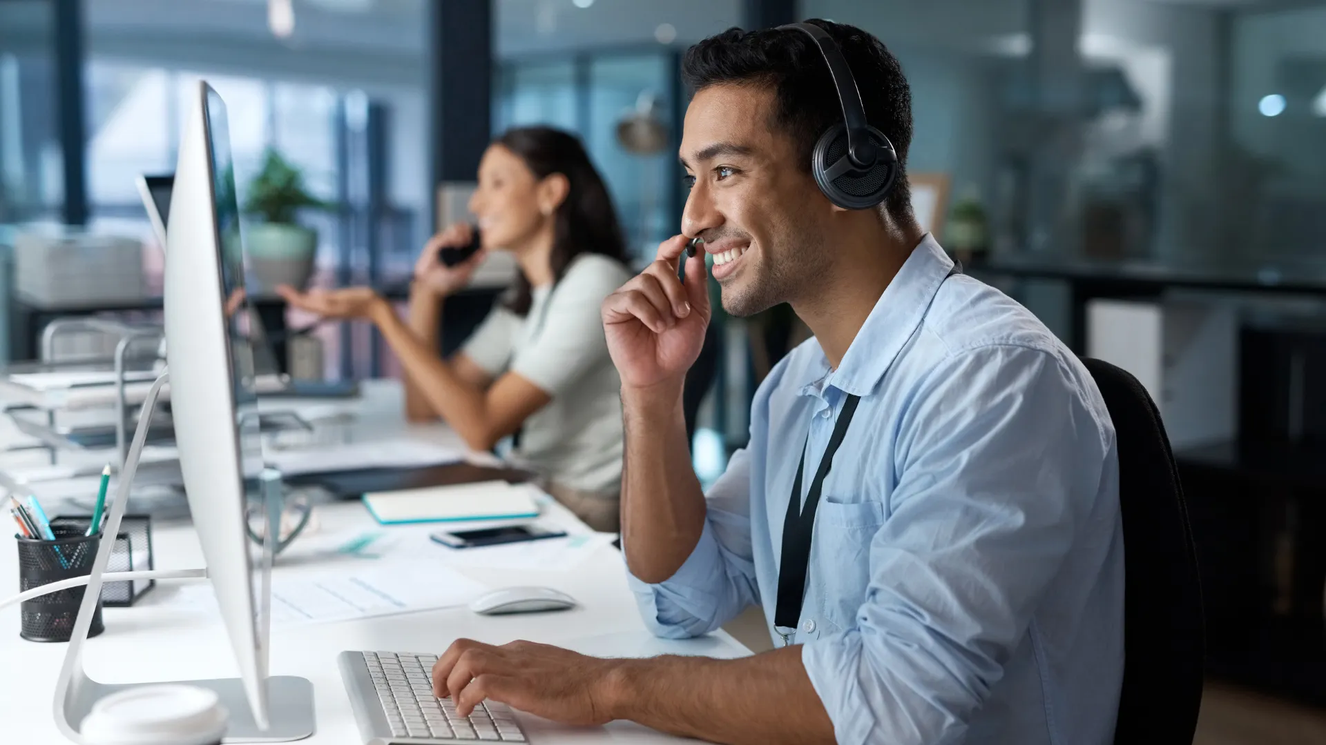 Sales agent wearing a headset talking with a customer